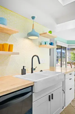 a kitchen with a large white sink in a room at Charming Coastal Retreat in Solana Beach in Solana Beach