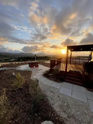 a gazebo with the sunset in the background at Cozy Camper with Fire Pit and Beautiful Sunsets in California in Temecula