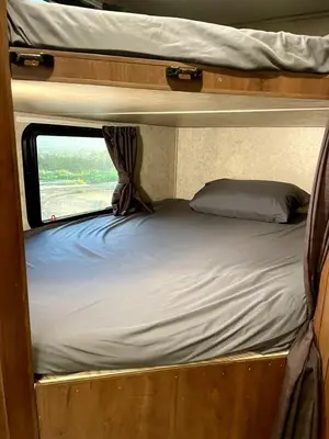 an inside view of a bunk bed in a room at Cozy Camper with Fire Pit and Beautiful Sunsets in California in Temecula