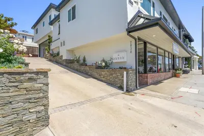 an empty street in front of a building at Ocean VIEWS Steps from Victoria Beach Lux Design in Laguna Beach