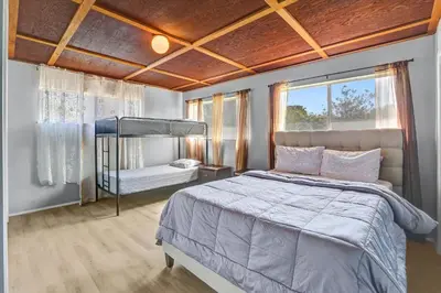 a bedroom with a large bed and a window at 16 Plus ADU Solana Beach DelMar Fair in Encinitas