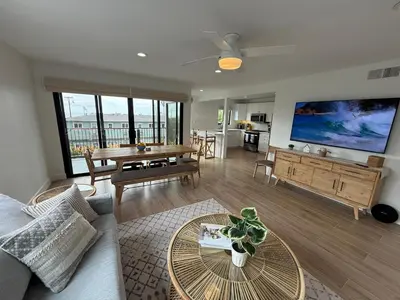a living room with a couch and a table at Modern Laguna Beach Duplex - Prime Location! in Laguna Beach