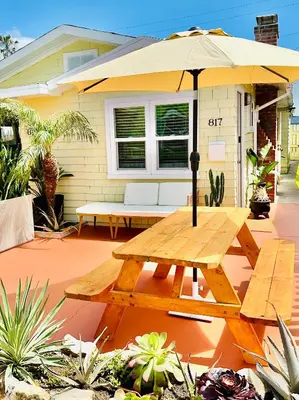 a picnic table with an umbrella on a patio at Casa Sol in San Diego