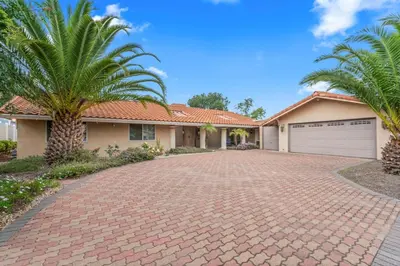 a brick driveway in front of a house with palm trees at Home in San Diego! The Blue Leaf with 3bed 2bath, Golf, Large Yard! in Rancho Bernardo