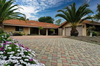 a house with palm trees and a driveway at Home in San Diego! The Blue Leaf with 3bed 2bath, Golf, Large Yard! in Rancho Bernardo