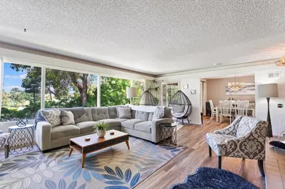 a living room with a couch and a table at Home in San Diego! The Blue Leaf with 3bed 2bath, Golf, Large Yard! in Rancho Bernardo