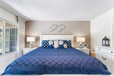 a bedroom with a blue bed with two lamps at Home in San Diego! The Blue Leaf with 3bed 2bath, Golf, Large Yard! in Rancho Bernardo