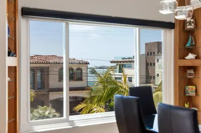 a large window with a view of a building at Pacific Beach Rooftop Views in San Diego