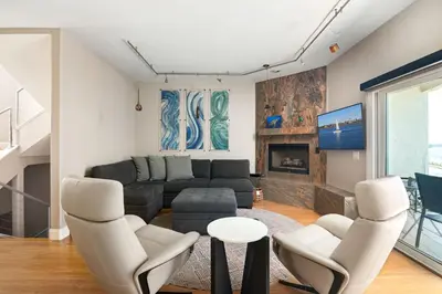 a living room with a couch and chairs at Pacific Beach Rooftop Views in San Diego