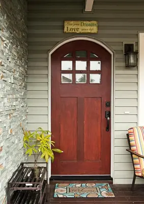 a wooden door on a house with a sign above it at Getaway Beach Bungalow - Kid and Pet Friendly in Carlsbad