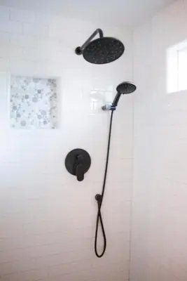 a shower with a shower head in a bathroom at Getaway Beach Bungalow - Kid and Pet Friendly in Carlsbad