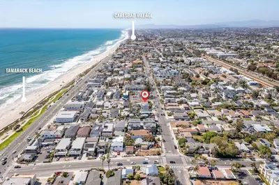 an aerial view of a beach with houses and the ocean at Carlsbad Cottage - Remodeled in Carlsbad