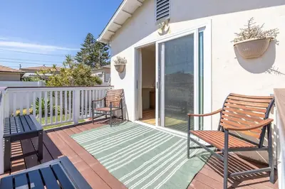 a patio with two chairs on a deck at Carlsbad Cottage - Remodeled in Carlsbad