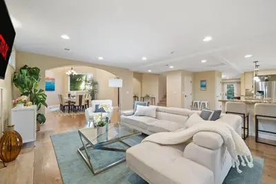a living room with a white couch and a table at Oceanview Luxe Retreat with Rooftop in San Diego