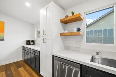 a kitchen with a sink and a window at Dog-Friendly House with Hot Tub, AC, Game Room in Oceanside