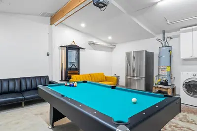 a living room with a pool table at Dog-Friendly House with Hot Tub, AC, Game Room in Oceanside
