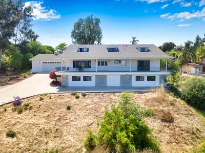 an aerial view of a large white house at Mountain View 6BR Pool, Spa and Games Room in El Cajon