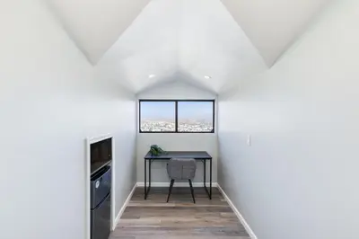 a dining room with a table and a window at Mountain View 6BR Pool, Spa and Games Room in El Cajon