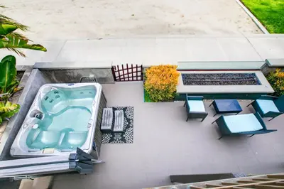 an aerial view of a bath tub and a table and chairs at Boardwalk Studio Shared Hot Tub and Patio in San Diego