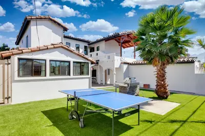 a ping pong table in front of a house at Luxury Oasis with Ping Pong, Firepit and Cozy Patio in San Clemente