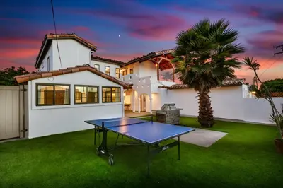 a ping pong table in front of a house at Luxury Oasis with Ping Pong, Firepit and Cozy Patio in San Clemente