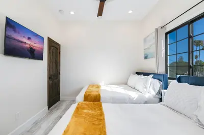 a bedroom with two beds and a couch at Inviting 3BR Space with Firepit in San Clemente