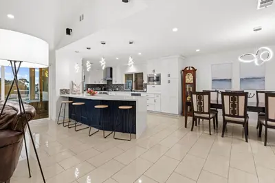 a kitchen and living room with a table and chairs at Modern La Jolla Escape Pool Rooftop Views in San Diego