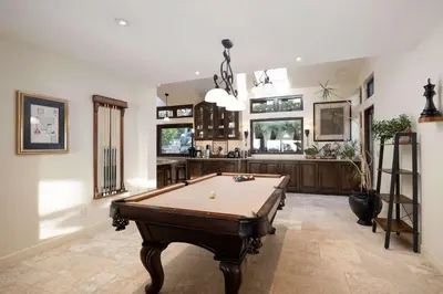 a large room with a pool table in it at Oceanfront Luxury Home Sunset Views in San Diego