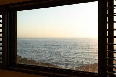 a view of the ocean from a window at Oceanfront Luxury Home Sunset Views in San Diego