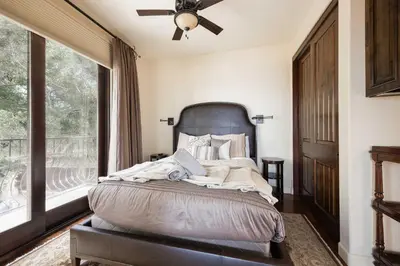 a bedroom with a bed with a large window at Oceanfront Luxury Home Sunset Views in San Diego