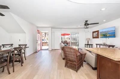 a kitchen and living room with a table and chairs at 3Br Coastal Home W Large Oceanview Patio, Steps To Sand By Beachview Rentals in Newport Beach
