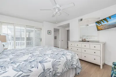 a bedroom with a bed and a dresser and a window at 4Br Coastal Home W Oceanview Patio, Close To The Beach By Beachview Rentals in Newport Beach