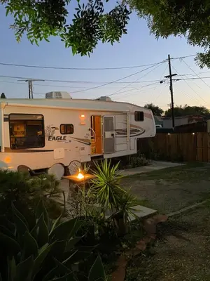 a white rv parked in a yard at La Mesa Cozy Camper in San Diego
