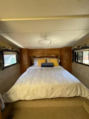 a large bed in the middle of a camper van at La Mesa Cozy Camper in San Diego