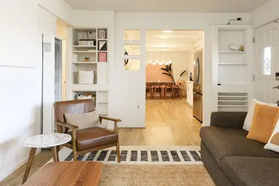 a living room with a couch and a chair at Casa Ciela, AC,Spa,15 min Downtown, Beach, Theatre in San Diego