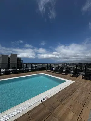a swimming pool on the roof of a building at The zinnia-Downtown SDiego Marina View Stay in San Diego