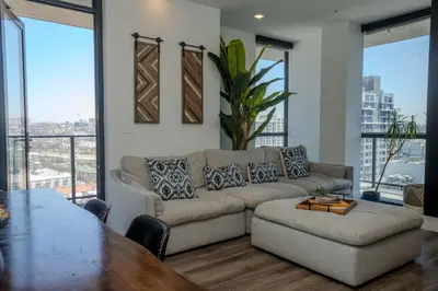 a living room with a couch and a table at The zinnia-Downtown SDiego Marina View Stay in San Diego