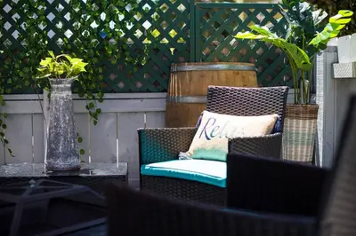 a patio with a chair and a vase on a table at #759 PetFriendly Beachside retreat/laundry&Parking in San Diego