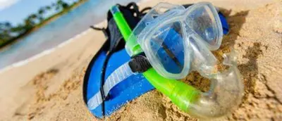 a pair of glasses sitting on the beach at Sunnyside Resort Spa, Beach, Zoo, Arcade in La Mesa