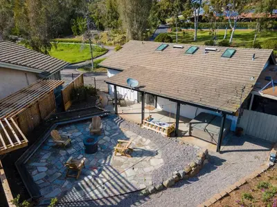 an aerial view of a house with a patio at Secluded Oasis: Pickleball, Jacuzzi, Pool, & Views in Lakeside