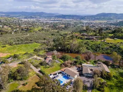 an aerial view of a house with a pool at Secluded Oasis: Pickleball, Jacuzzi, Pool, & Views in Lakeside