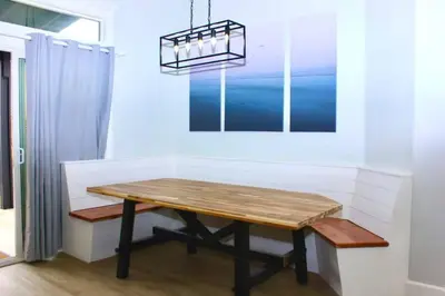 a dining room with a wooden table and a chandelier at Secluded Oasis: Pickleball, Jacuzzi, Pool, & Views in Lakeside