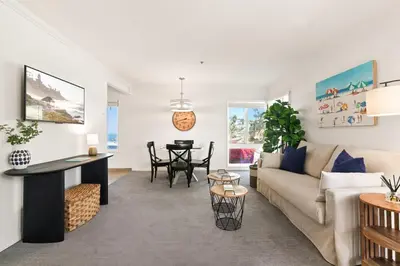 a living room with a couch and a table at Seize the Day in San Diego