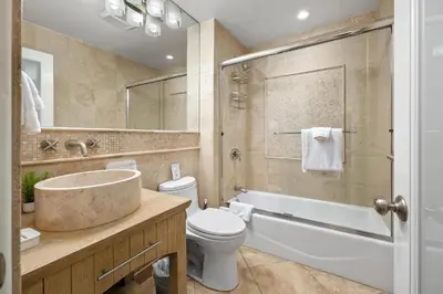 a bathroom with a sink toilet and a tub at Surf Song Symphony - SONG55 in Solana Beach