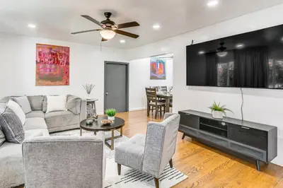 a living room with a couch and a tv at Home 3 Miles to Balboa Park and San Diego Zoo! in San Diego