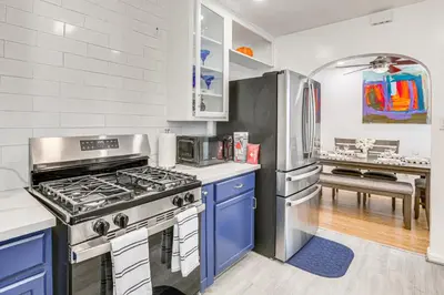 a kitchen with a stove and a refrigerator at Home 3 Miles to Balboa Park and San Diego Zoo! in San Diego