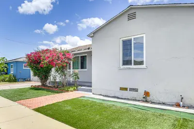 a white house with a window and a yard at Home 3 Miles to Balboa Park and San Diego Zoo! in San Diego