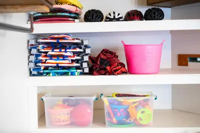 a shelf filled with lots of baskets and cups at Coastal Escape Ping Pong Bikes and Steps to Sand in San Diego