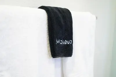 a black towel on the side of a white shirt at Coastal Escape Ping Pong Bikes and Steps to Sand in San Diego