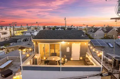 a house with lights on the roof at dusk at Mission Beach 3BR Gem Rooftop Patio and Hot Tub in San Diego